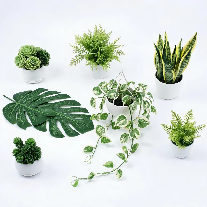 Collection of artificial plants including succulents, ferns, and monstera